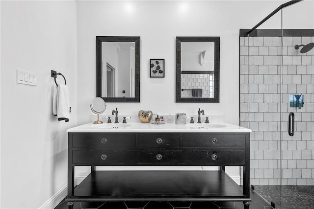 bathroom featuring tile patterned flooring, vanity, and an enclosed shower