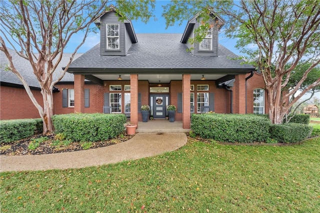 view of front facade with a porch and a front yard