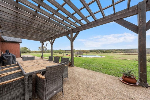 view of patio featuring a pergola, a rural view, and grilling area