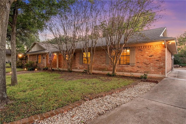 ranch-style house with a lawn