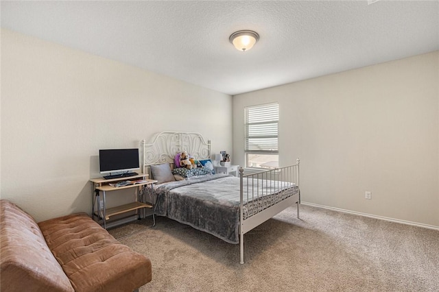 carpeted bedroom with a textured ceiling