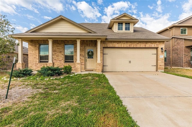 craftsman-style home featuring a front lawn and a garage