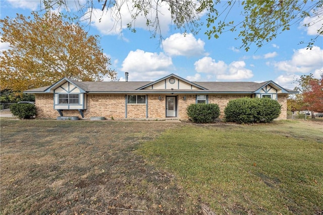 single story home featuring a front lawn