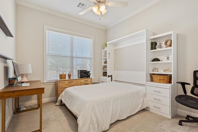 bedroom with ceiling fan, light colored carpet, visible vents, baseboards, and crown molding