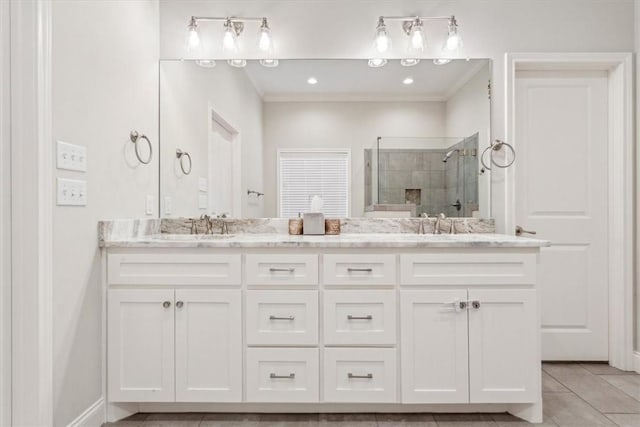 full bathroom with a sink, double vanity, tile patterned flooring, and a shower stall