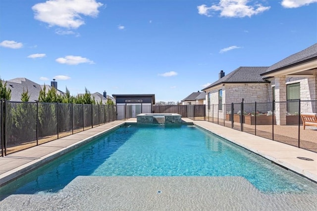 view of swimming pool featuring a patio, a fenced backyard, and a pool with connected hot tub