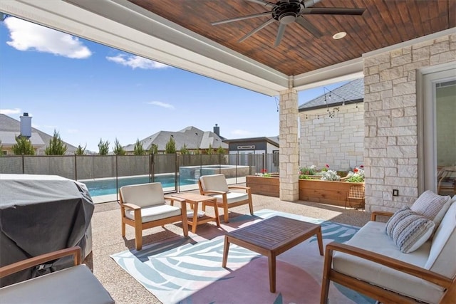 view of patio / terrace featuring an outdoor hangout area, a fenced backyard, a fenced in pool, and a ceiling fan