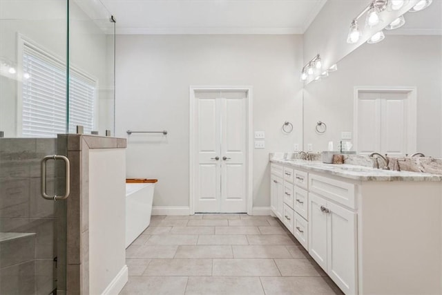 full bathroom with tile patterned flooring, ornamental molding, a soaking tub, double vanity, and a stall shower