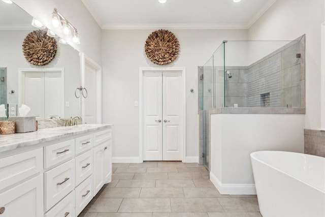 full bathroom featuring a freestanding bath, ornamental molding, a stall shower, and vanity