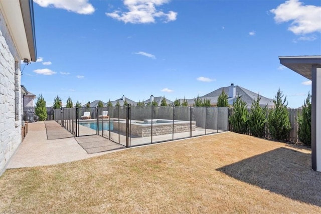 view of pool with a fenced in pool, a patio area, a fenced backyard, and a yard