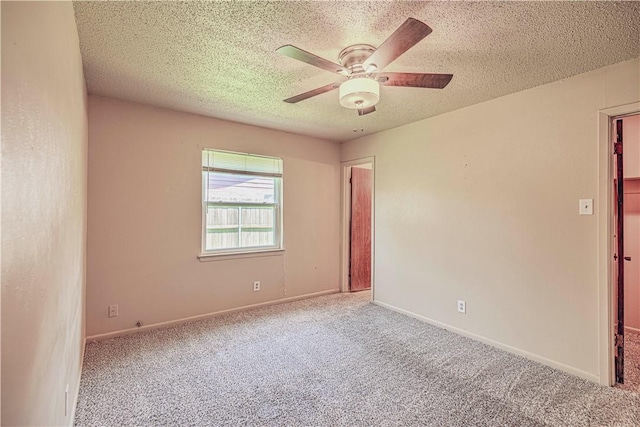 unfurnished room with light carpet, a textured ceiling, and ceiling fan