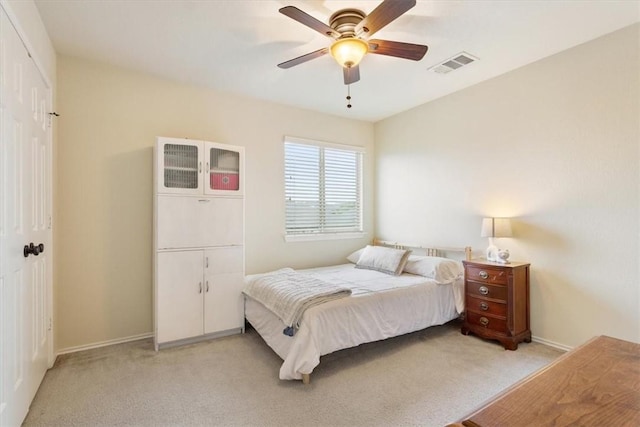 carpeted bedroom with ceiling fan