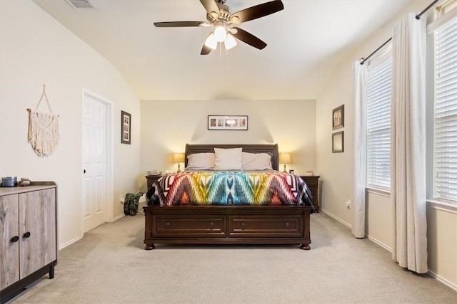 carpeted bedroom with ceiling fan and lofted ceiling