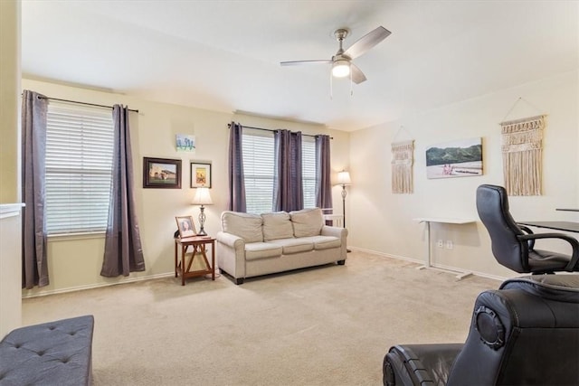 living room with light carpet and ceiling fan