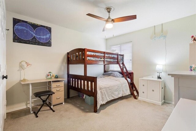 bedroom with light colored carpet and ceiling fan