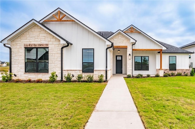 modern farmhouse style home with a front yard