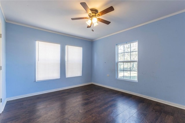 spare room with ceiling fan, dark hardwood / wood-style flooring, and crown molding