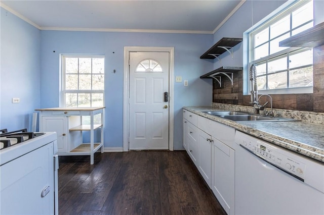 kitchen with sink, dark hardwood / wood-style flooring, crown molding, white appliances, and white cabinets