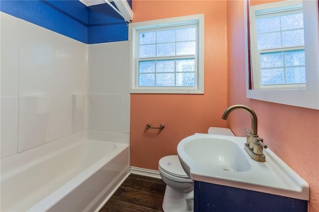 full bathroom featuring vanity, hardwood / wood-style flooring, toilet, and plenty of natural light