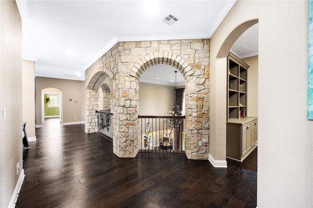 corridor featuring dark hardwood / wood-style floors and ornamental molding