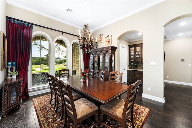 dining space with a chandelier, dark hardwood / wood-style floors, and crown molding