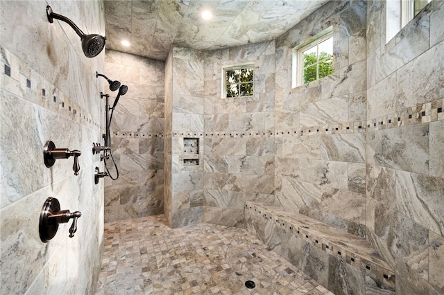 bathroom with tiled shower