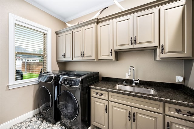 laundry area with cabinets, sink, tile patterned flooring, ornamental molding, and separate washer and dryer