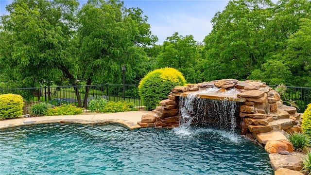 view of pool featuring pool water feature