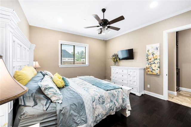 bedroom featuring ceiling fan, dark wood-type flooring, and ornamental molding