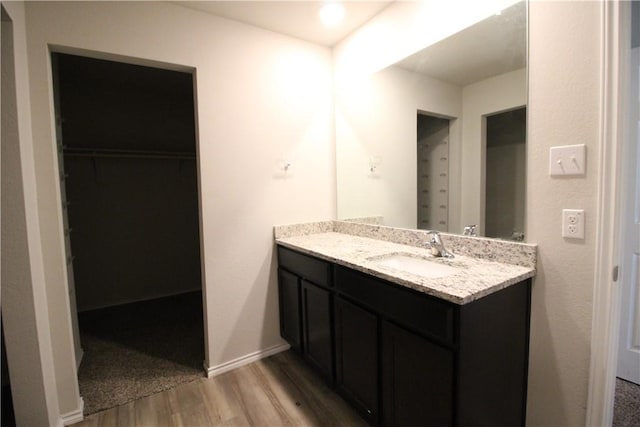 bathroom featuring vanity and wood-type flooring