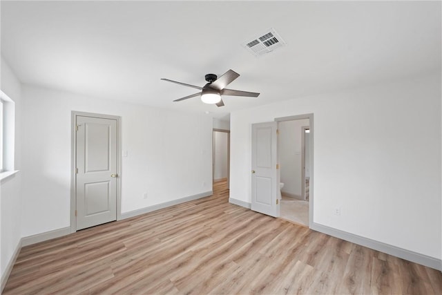 unfurnished bedroom featuring ceiling fan, light hardwood / wood-style flooring, and ensuite bathroom