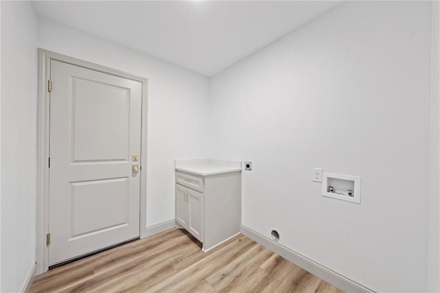 laundry room with electric dryer hookup, cabinets, washer hookup, and light wood-type flooring