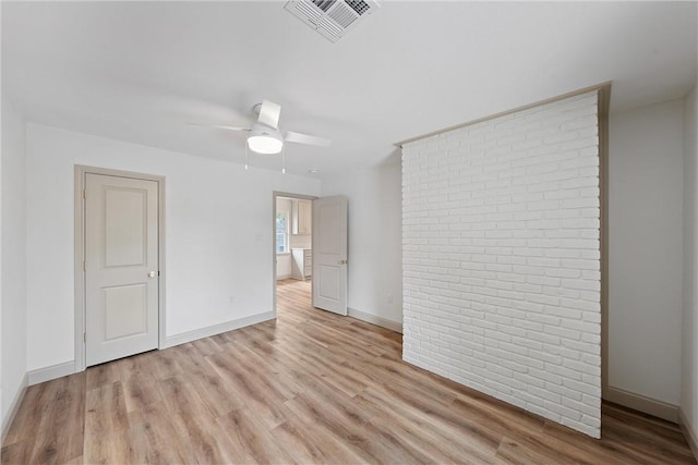 unfurnished room featuring light wood-type flooring and ceiling fan