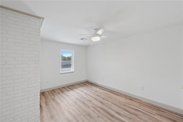 unfurnished room with light hardwood / wood-style floors and ceiling fan