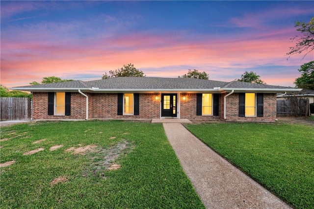 ranch-style house featuring a yard