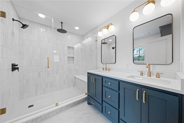 bathroom with vanity and a shower with door