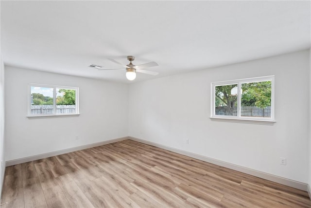 spare room featuring ceiling fan and light hardwood / wood-style flooring