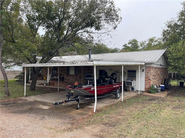 view of front of home featuring a carport