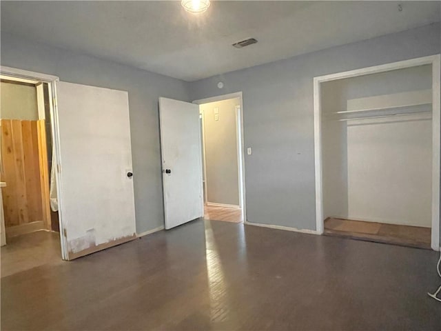 bedroom featuring dark wood-type flooring and a textured ceiling