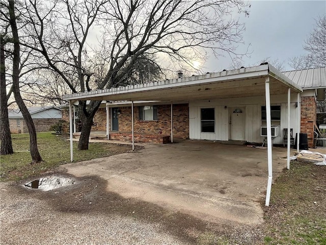 view of front of property with a carport