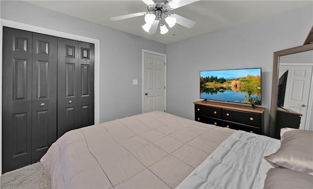 bedroom featuring ceiling fan, a closet, and carpet flooring