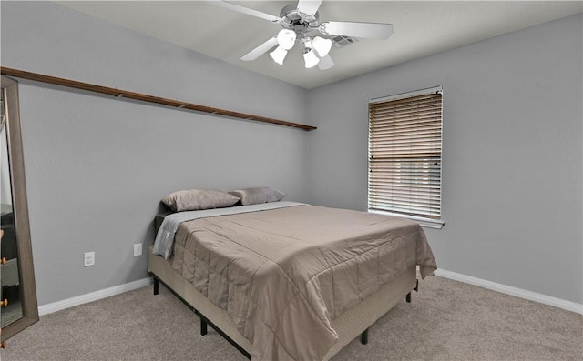 bedroom featuring carpet floors, ceiling fan, and baseboards