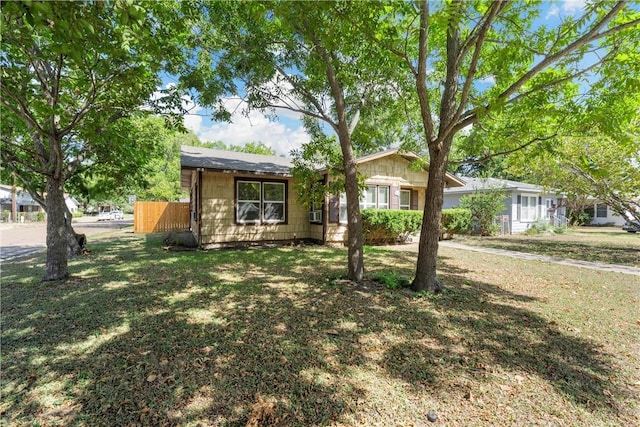 ranch-style house with a front lawn