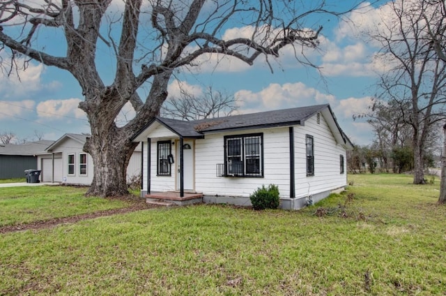 ranch-style home featuring a front yard