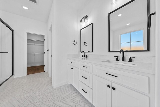 bathroom with vanity, tile patterned floors, and walk in shower