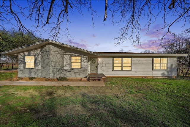 view of front of property with a yard