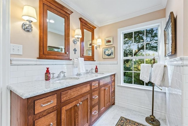 bathroom featuring tile patterned flooring, vanity, ornamental molding, and tile walls