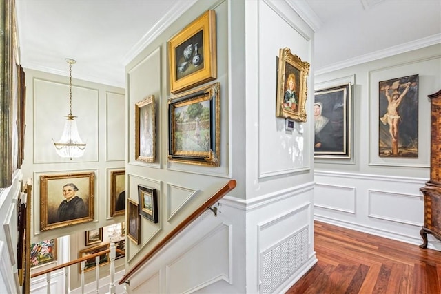 interior space featuring hardwood / wood-style flooring and ornamental molding