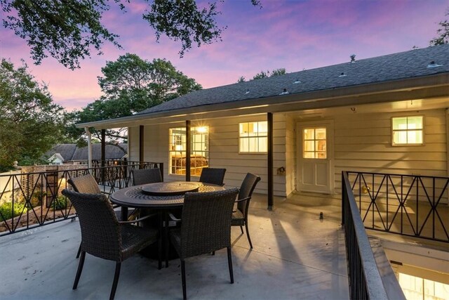 view of patio terrace at dusk