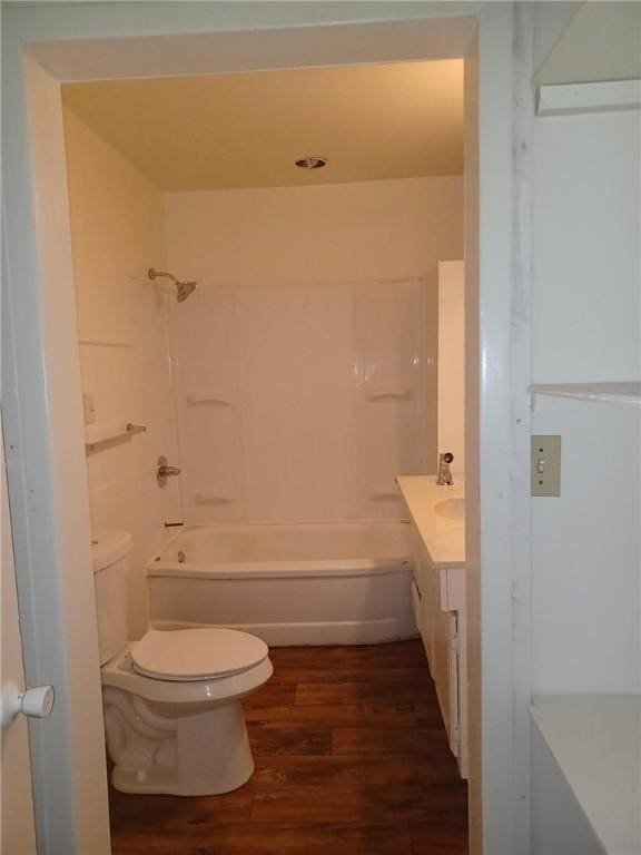 full bathroom featuring toilet, vanity, shower / bathtub combination, and hardwood / wood-style flooring